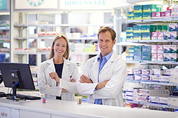 Portrait of two pharmacists standing at the prescription counterhttp://195.154.178.81/DATA/istock_collage/0/shoots/785216.jpg