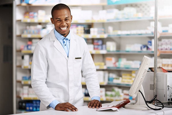 Portrait of a young pharmacist working in a chemist